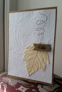 A Bit Of Glue & Paper - kraft card, white panel embossed with leaves, embellished with fabric leaf below stamped dotted line representing falling, die cut kraft flag stamped with hello; CAS(E) This Sketch #215 - Vancouver BC