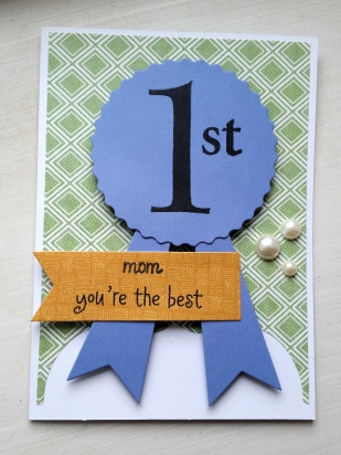 A Bit Of Glue & Paper - handmade Mother's Day card with die cut blue ribbon stamped with 1st, stamped with mom you're the best, green geometric patterned paper, embellished with pearls; Freshly Made Sketches 283 #FMS283 - Vancouver BC